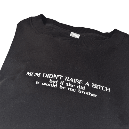 Everyday embroidered crew jumper for siblings with cheeky phrase on black fabric.